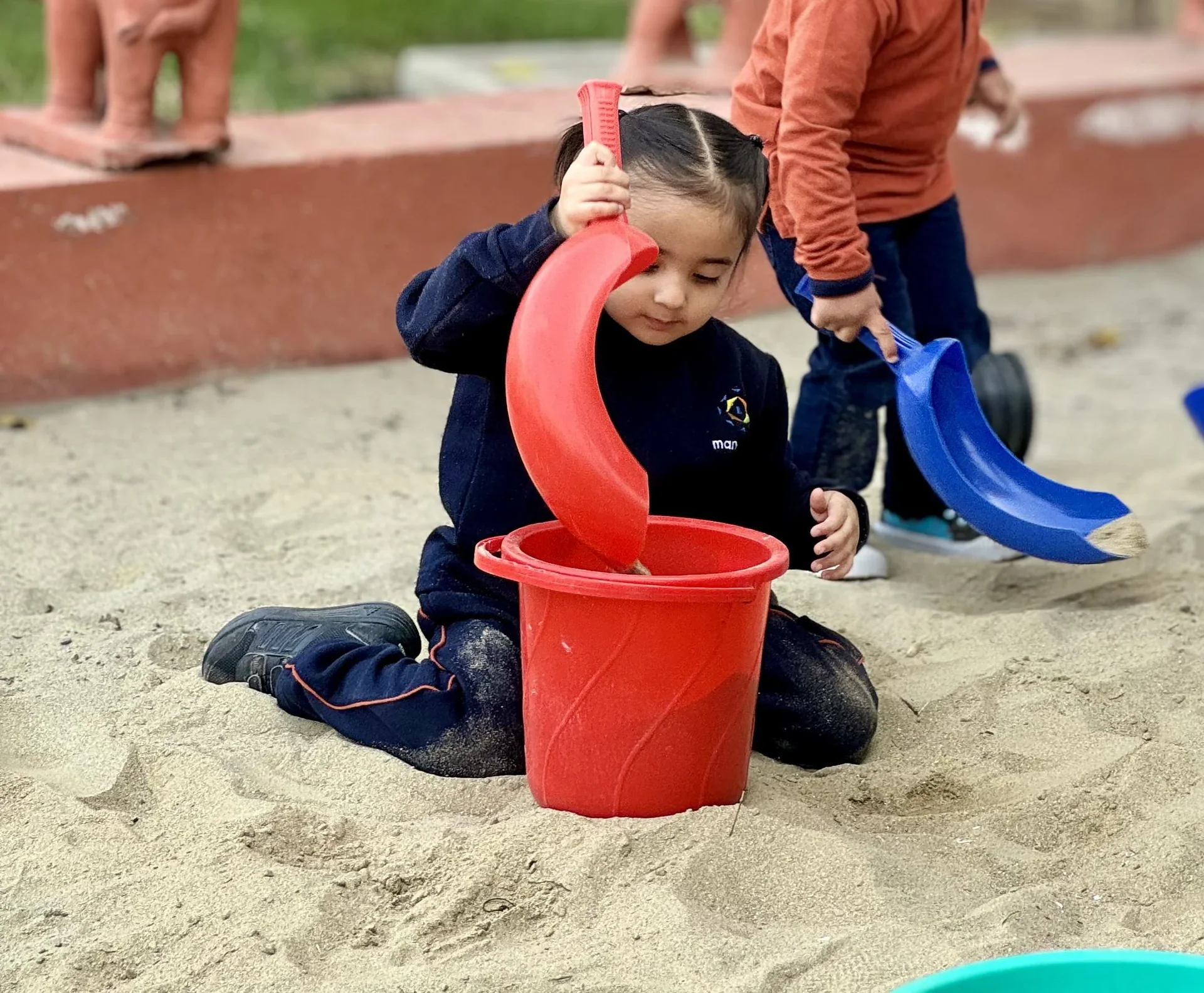 Early years students playing in the sand pit zone at Manaskriti School Faridabad