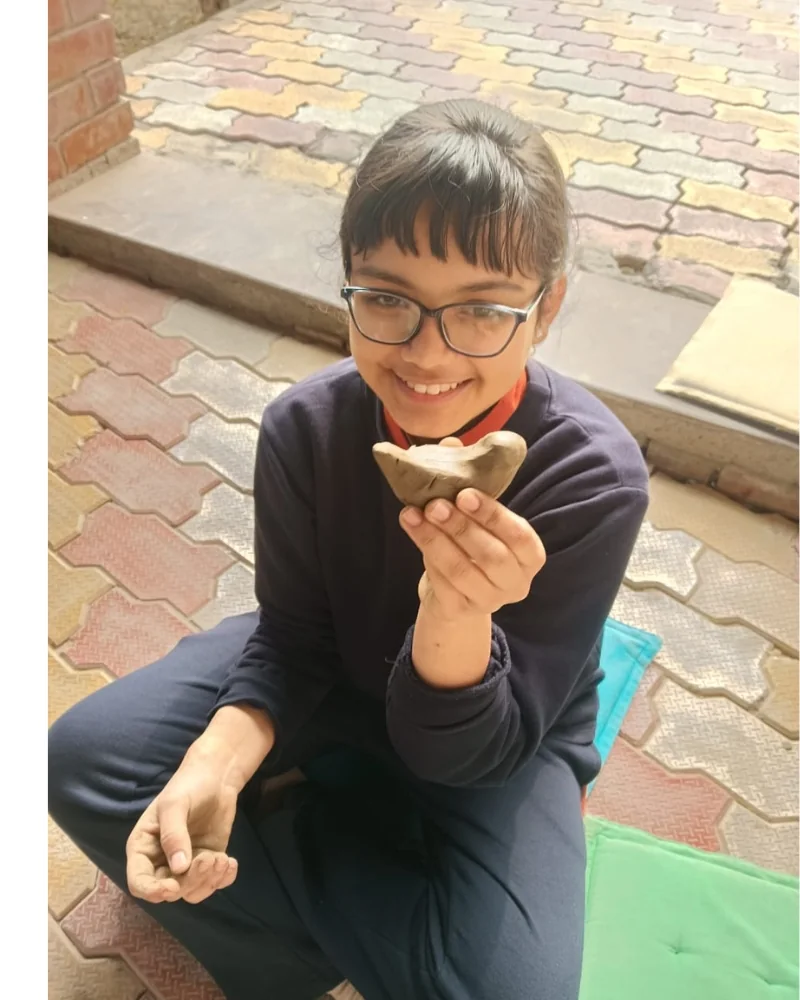 Student participating in a clay modelling activity at Manaskriti School Faridabad