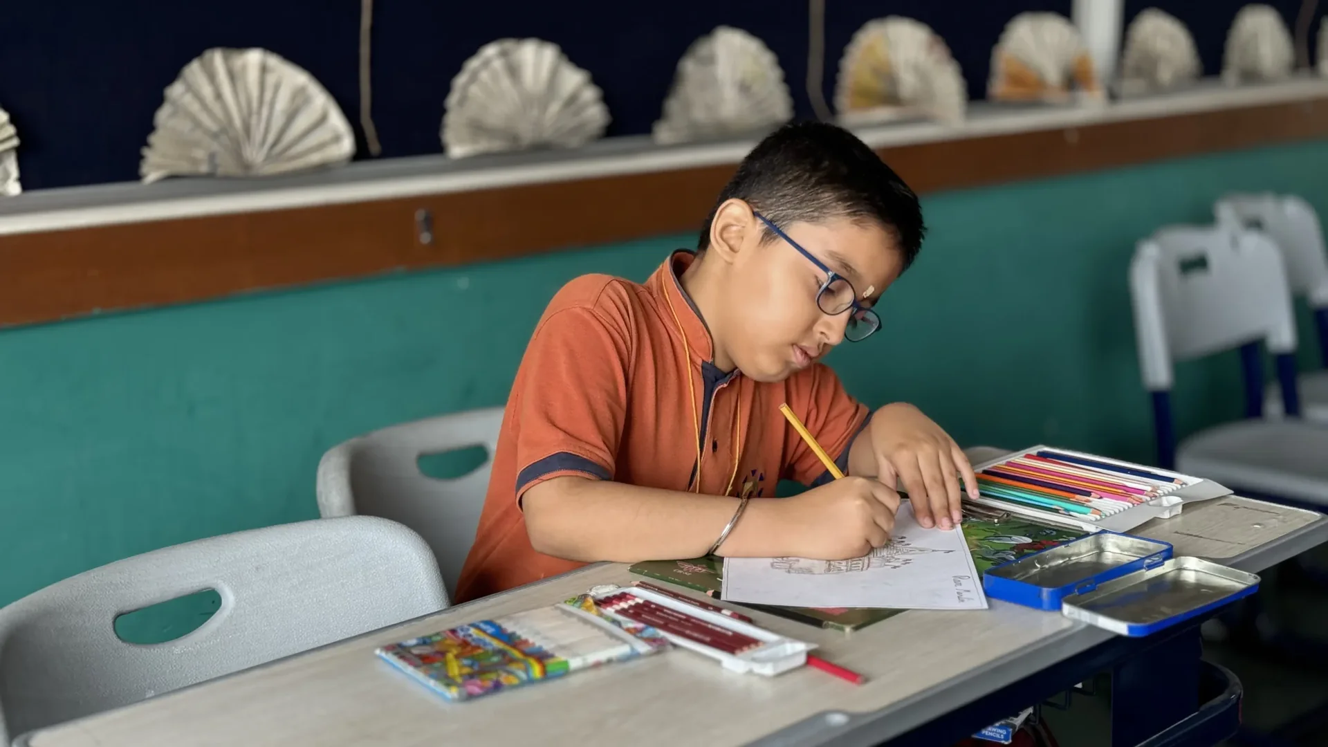 Student drawing during an art and expression activity at Manaskriti School Faridabad