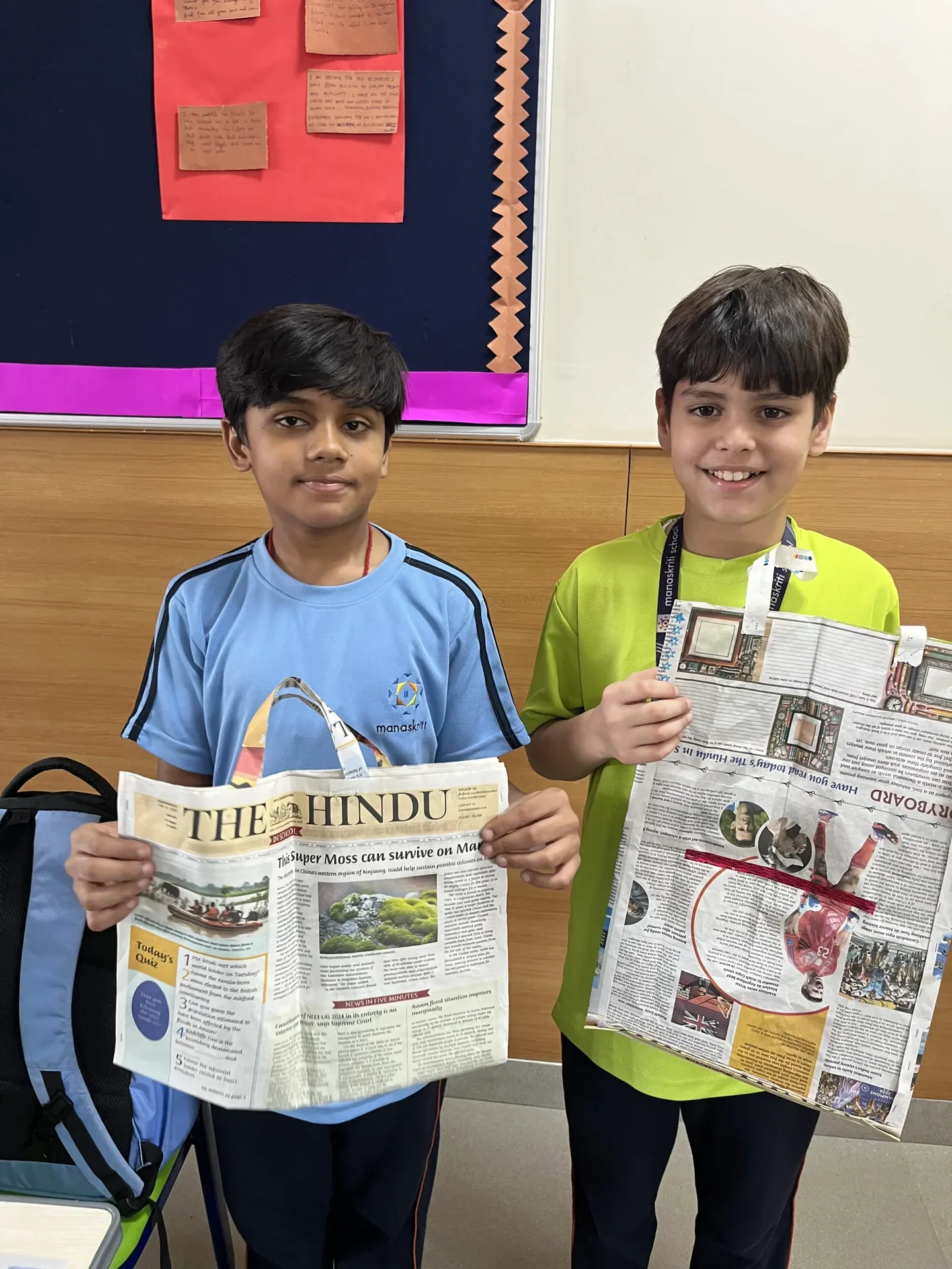Students creating newspaper bags during a creative learning activity at Manaskriti School Faridabad