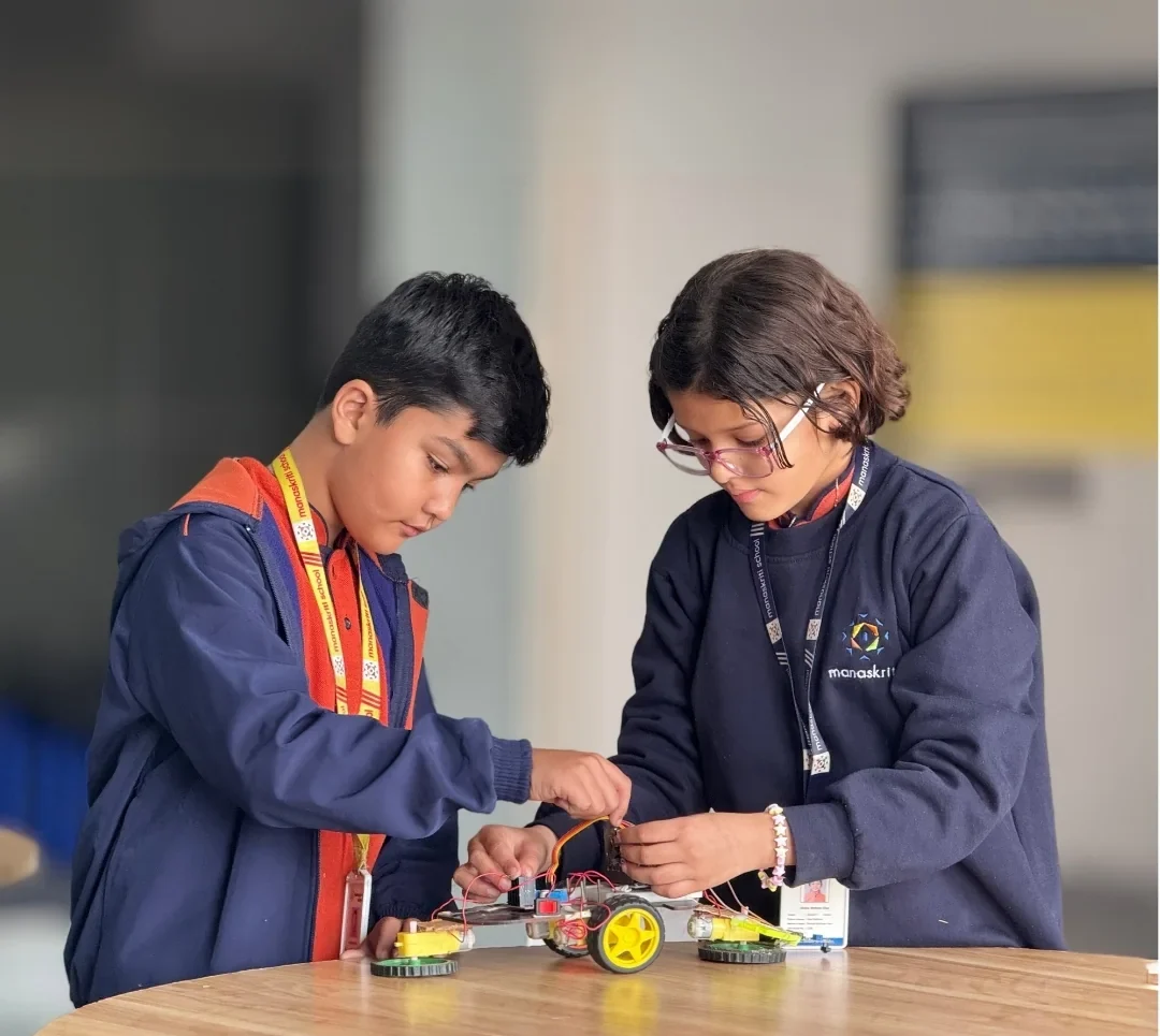 Students exploring robotics in the Maker's Lab at Manaskriti School Faridabad